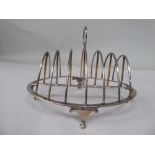 A late George III silver six division toastrack of oval outline with a wire framed superstructure,