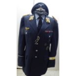 A German World War II design SS military design tunic with emblems and a peaked cap (Please Note: