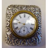 A late Victorian silver cased travel timepiece, faced by a Roman dial with subsidiary seconds