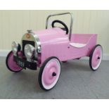 A Baghera painted model pedal car, in pink livery with rubber wheels  32"L overall