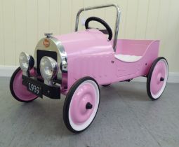 A Baghera painted model pedal car, in pink livery with rubber wheels  32"L overall