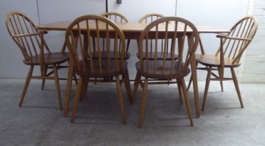 An Ercol blonde elm and beech dining table, raised on splayed, square, tapered legs  28.5"h  59"L;