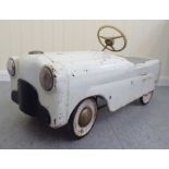 A vintage American style pedal car, in white livery with rubber wheels  33"L overall