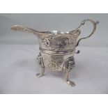 A late 18th/early 19thC Irish silver cream jug of cauldron form with a flared, decoratively cut