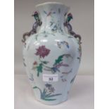 A 20thC Chinese porcelain vase of flattened and panelled baluster form, incorporating opposing,