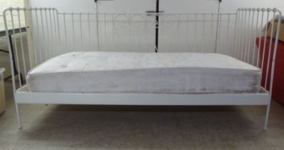A 20thC white painted tubular and C-scrolled metal framed three side open day bed  77"w  37"deep