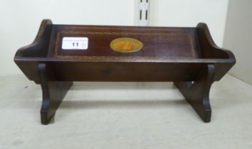 An Edwardian string inlaid mahogany book trough  10"w