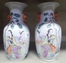 A pair of early 20thC Chinese porcelain vases, decorated with a female figure, each bearing a six