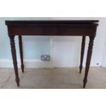 A Regency mahogany tea table, the foldover top on a rear gate leg action, raised on turned legs