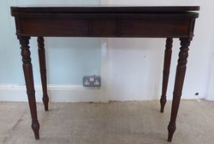 A Regency mahogany tea table, the foldover top on a rear gate leg action, raised on turned legs