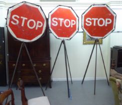 A set of three way traffic Stop/Go signals, on tripod base