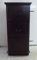 A modern mahogany three drawer filing cabinet, on a plinth  45"h  21"w