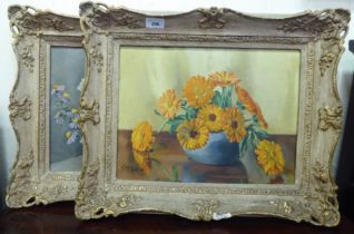 Two framed works by Gwen Gilroy - floral studies  oil on canvas  bearing signatures  11" x 15"
