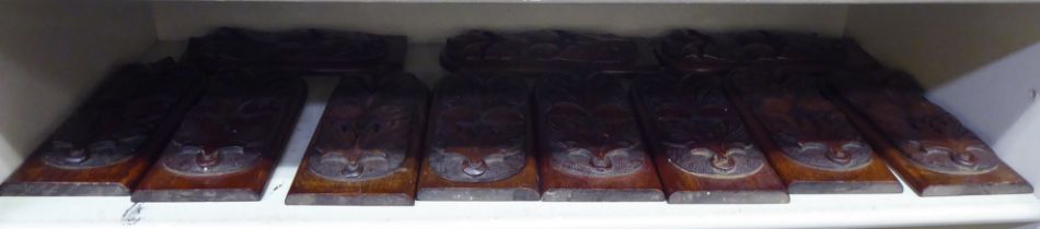 A set of eleven late 19thC Victorian mahogany furniture mounts with foliate carved ornament  9"h