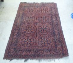 A Persian rug, decorated with repeating stylised designs, on a multi-coloured ground  52" x 80"