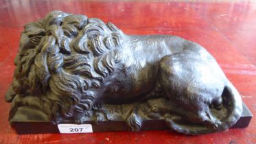 A modern bronze effect model, a recumbent lion  6"h