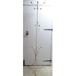 A 1960s white painted tubular steel, freestanding, rotating hat and coat stand with black plastic
