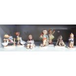 Seven Goebel/Hummel china figures: to include a boy with a telescope  4"h