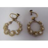 A pair of seed pearl earrings, each shaped as a wreath