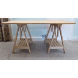 A modern stained beech work table, raised on trestle ends  30"h  62"L