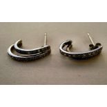 A pair of white gold earrings