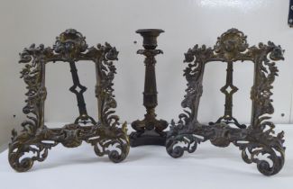 Metalware, viz. a pair of Victorian style cast brass picture frames, on easel backs; and a