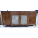 A modern Regency style yewwood finished, breakfront sideboard with ebony string inlaid decoration,