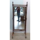An early 20thC mahogany framed cheval mirror, raised on splayed legs  72"h  29"w