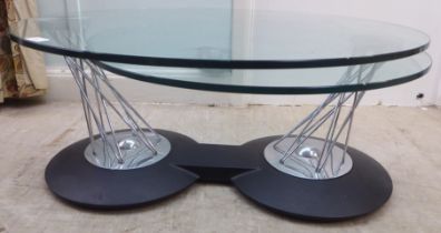 A modern chromium plated steel wire framed eclipse type table, comprising two plate glass tops,