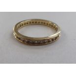 A 9ct gold eternity ring, set with myriad round-cut diamonds  boxed