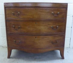 A mid 19thC mahogany bow front, three drawer dressing chest, raised on splayed legs  36"h  36"w