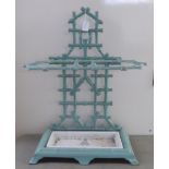 An early 20thC simulated bamboo painted, cast iron stickstand  24"h  20"w