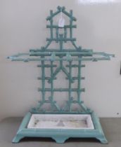 An early 20thC simulated bamboo painted, cast iron stickstand  24"h  20"w