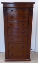 A late Victorian mahogany Wellington chest with seven drawers, on a plinth  43"h  21"w