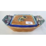 A Victorian Wedgwood majolica novelty sardine dish, in the form of a small fishing boat, decorated