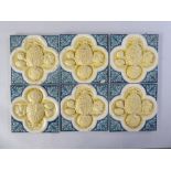 A set of six glazed Minton & Hollins tiles, decorated with fruit and vegetables  5.75"sq