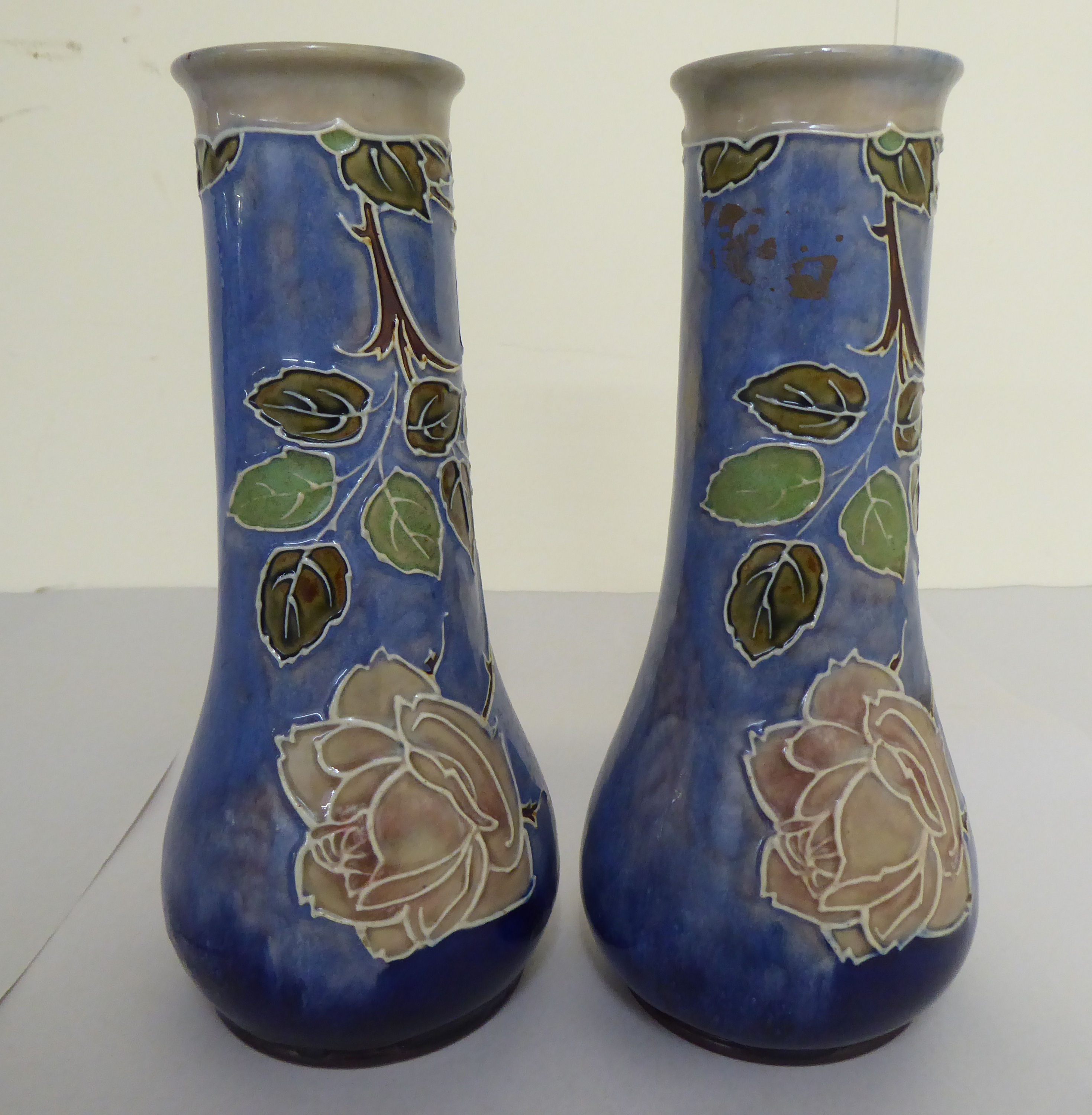 A pair of early 20thC Royal Doulton stoneware vases, decorated in tubeline with flora  bearing - Image 2 of 4