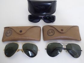 Three pairs of designer sunglasses