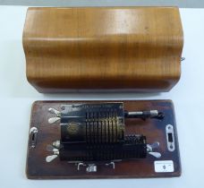 A Grimme Natalis & Co Brunsviga manual calculator, in a walnut case