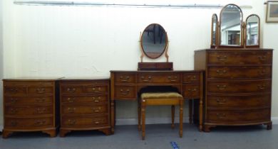 A modern yewwood bedroom suite, comprising a bow front five drawer dressing chest  40"h  35"w; a