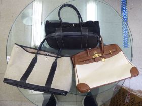 Three dissimilar ladies designer handbags