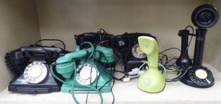 Vintage telephone handsets: to include a turquoise coloured plastic/Bakelite cased example with a