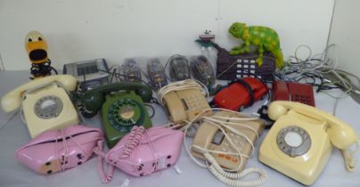 Various landline telephones: to include an example fashioned as a Chameleon on a log  14"h