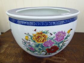 A modern Chinese porcelain planter, decorated with birds, flora and butterflies, on a white ground