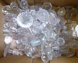 A miscellany of clear glass decanter stoppers