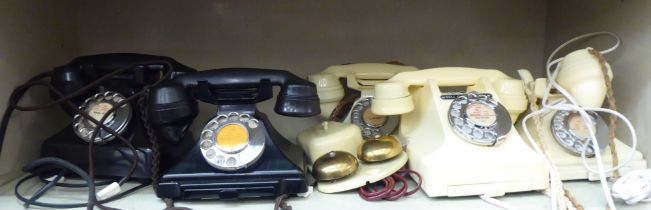Vintage telephone handsets: to include three ivory coloured plastic/Bakelite cased examples with