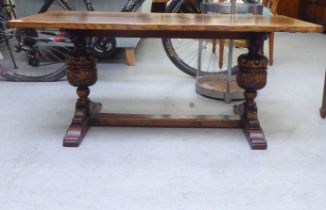 A 20thC Old English style oak coffee table, raised on carved bulbous legs and a splayed plinth  18"h