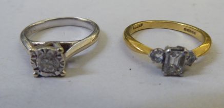 A 9ct white gold diamond solitaire ring; and an 18ct gold diamond ring