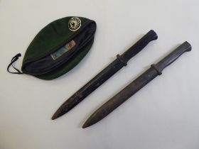 A pair of World War II period wooden training bayonets  16"L; and a mid 20thC French parachutists