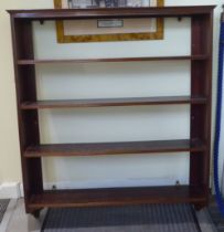 An Edwardian mahogany four tier hanging bookcase  39"h  46"w